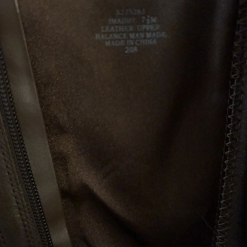 Isaac Mizrahi Live brown leather knee-high riding boots.